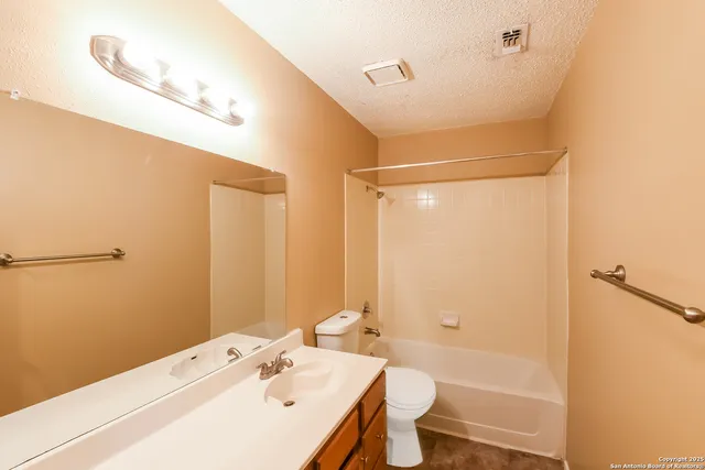 a view of a house with a yard and deck