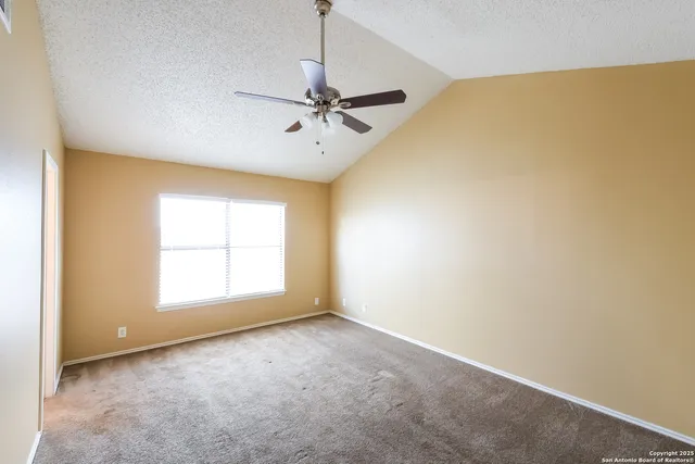 a bathroom with a tub a sink and a large mirror
