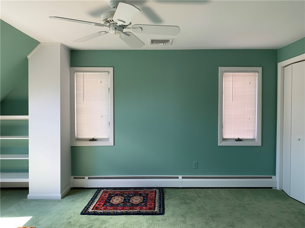 43 Lepes Road Portsmouth, RI 02871 - Photo 19 of 31 West side large bedroom with double closets, built in shelf and skylight for natural light.