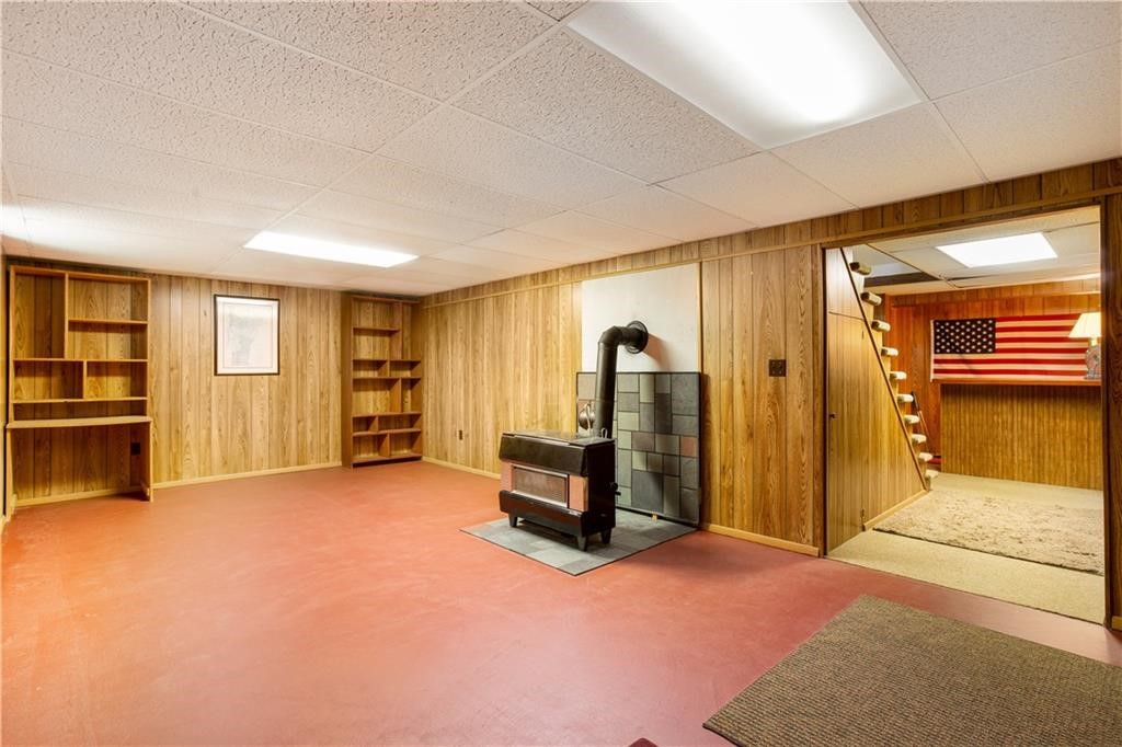 43 Lepes Road Portsmouth, RI 02871 - Photo 25 of 31 Large recreational room with a working coal stove.