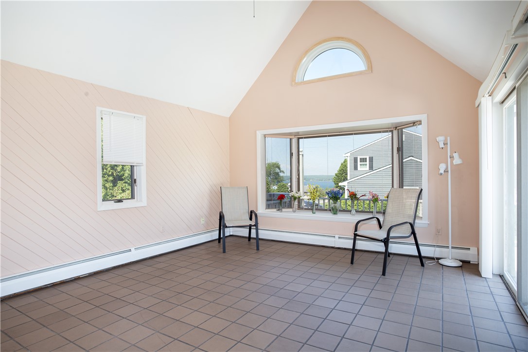 43 Lepes Road Portsmouth, RI 02871 - Photo 5 of 31 Located on the East side is the vaulted Sunroom/family room with large bow window that offers a beautiful. view of the Sakonnet and sliding glass doors to access the deck.