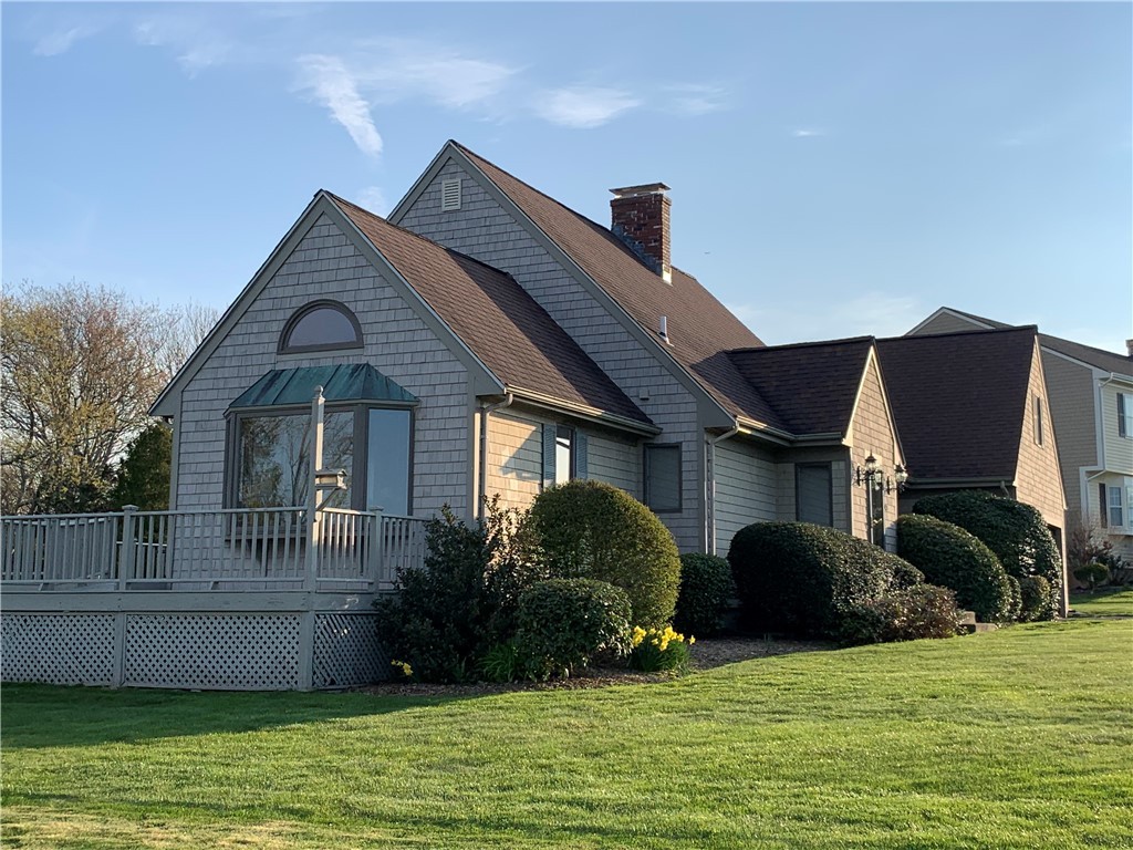 43 Lepes Road Portsmouth, RI 02871 - Photo 6 of 31 Beautiful East side view of the Gable roof line and wraparound deck.