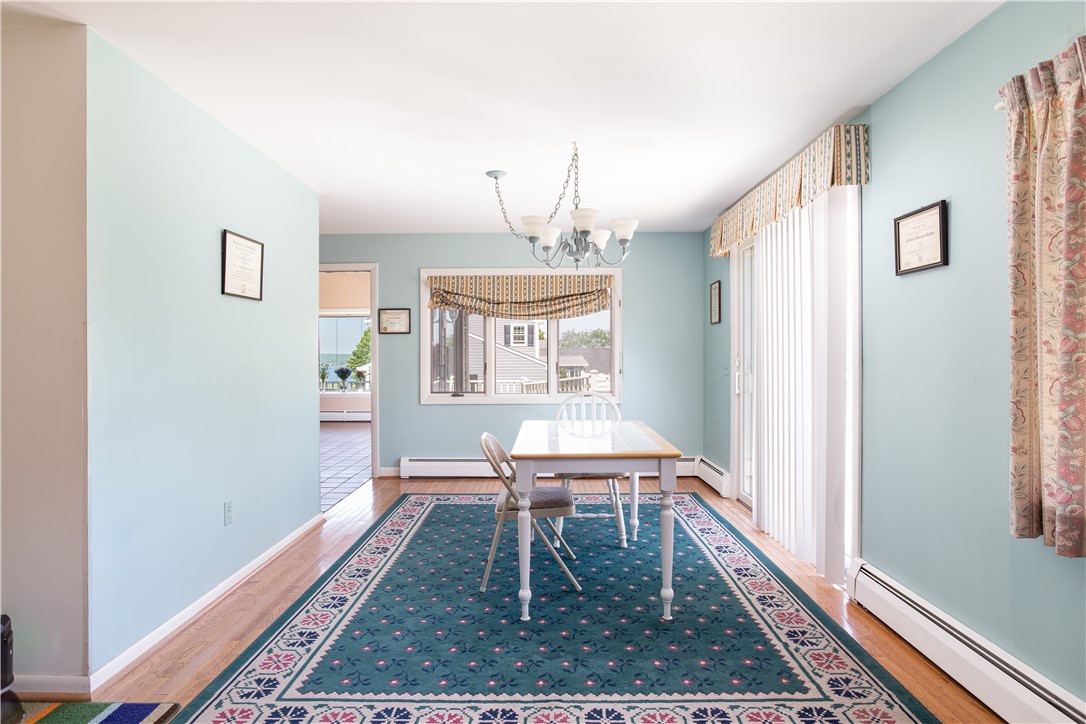 43 Lepes Road Portsmouth, RI 02871 - Photo 8 of 31 Dining room with sliding glass doors to wraparound deck.