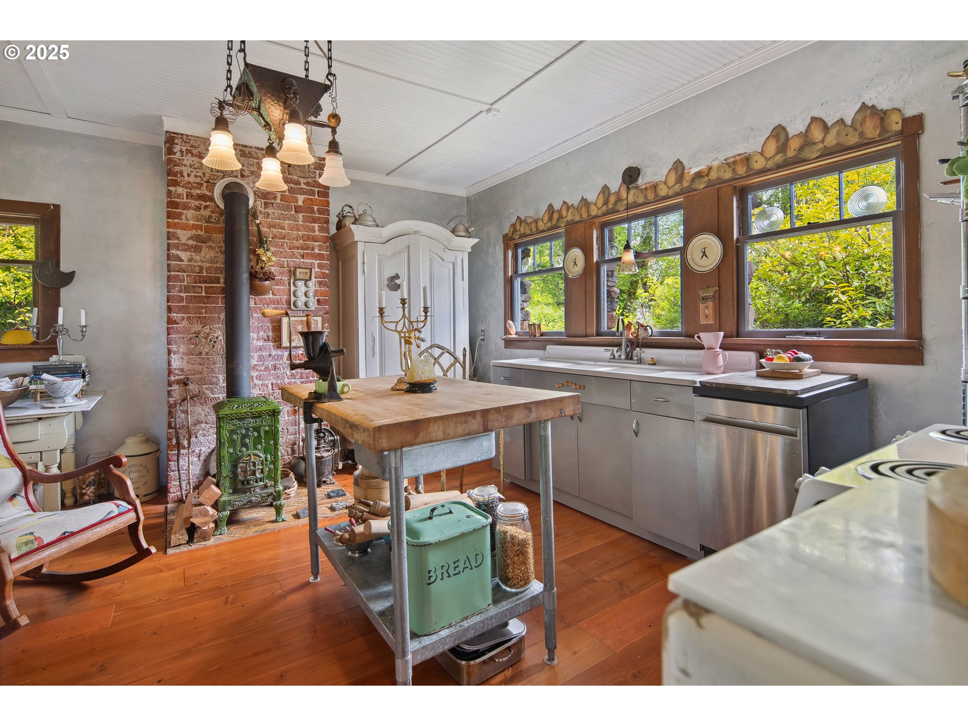91755 Lewis And Clark Road Astoria, OR 97103 - Photo 16 of 48 a kitchen with a sink stove and cabinets