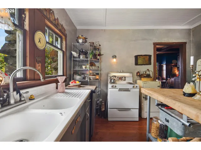 a kitchen that has a sink and a stove