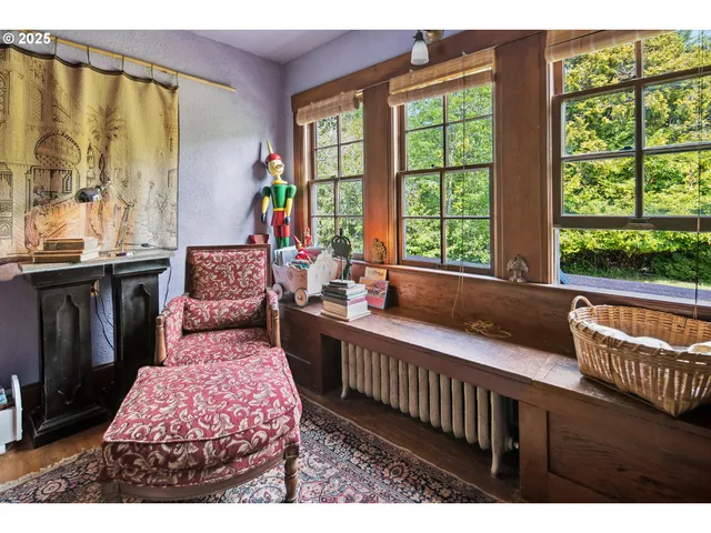 a living room with furniture and large windows