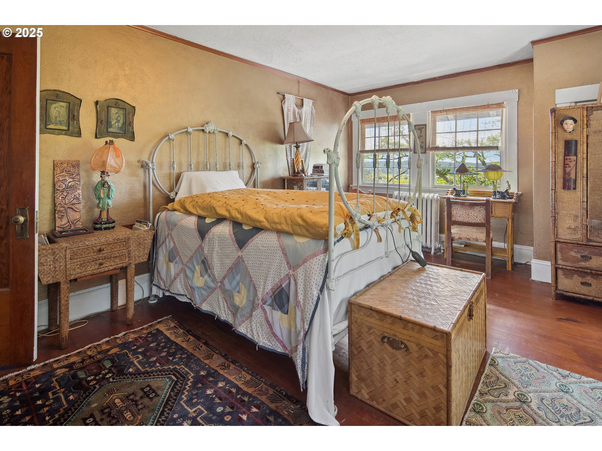 91755 Lewis And Clark Road Astoria, OR 97103 - Photo 22 of 48 a bedroom with a bed and wooden floor