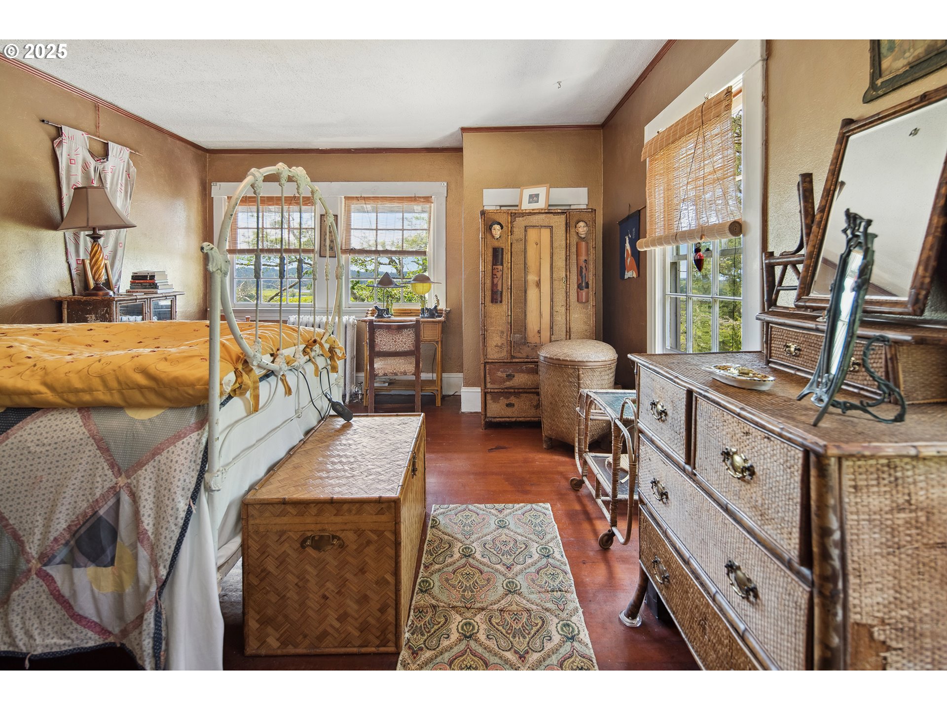 91755 Lewis And Clark Road Astoria, OR 97103 - Photo 23 of 48 a living room with furniture a large window wooden floor and a flat screen tv
