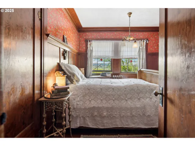 a view of a room with furniture and a window