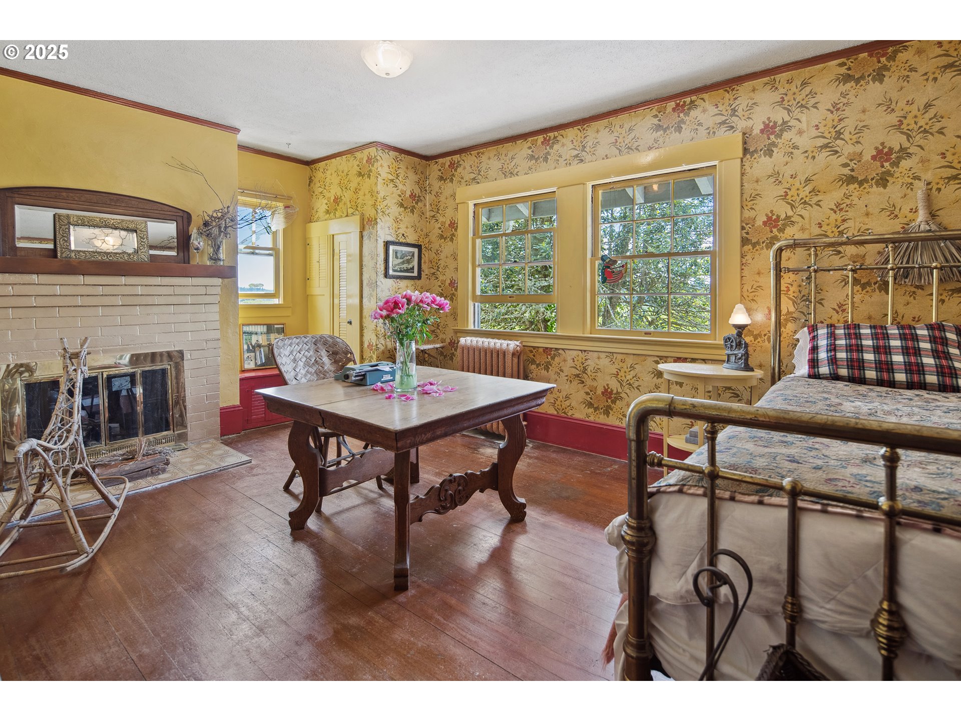 91755 Lewis And Clark Road Astoria, OR 97103 - Photo 27 of 48 a living room with furniture a fireplace and a floor to ceiling window