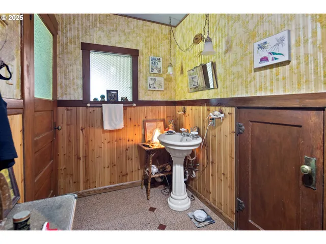 a bathroom with a sink a mirror and a shower