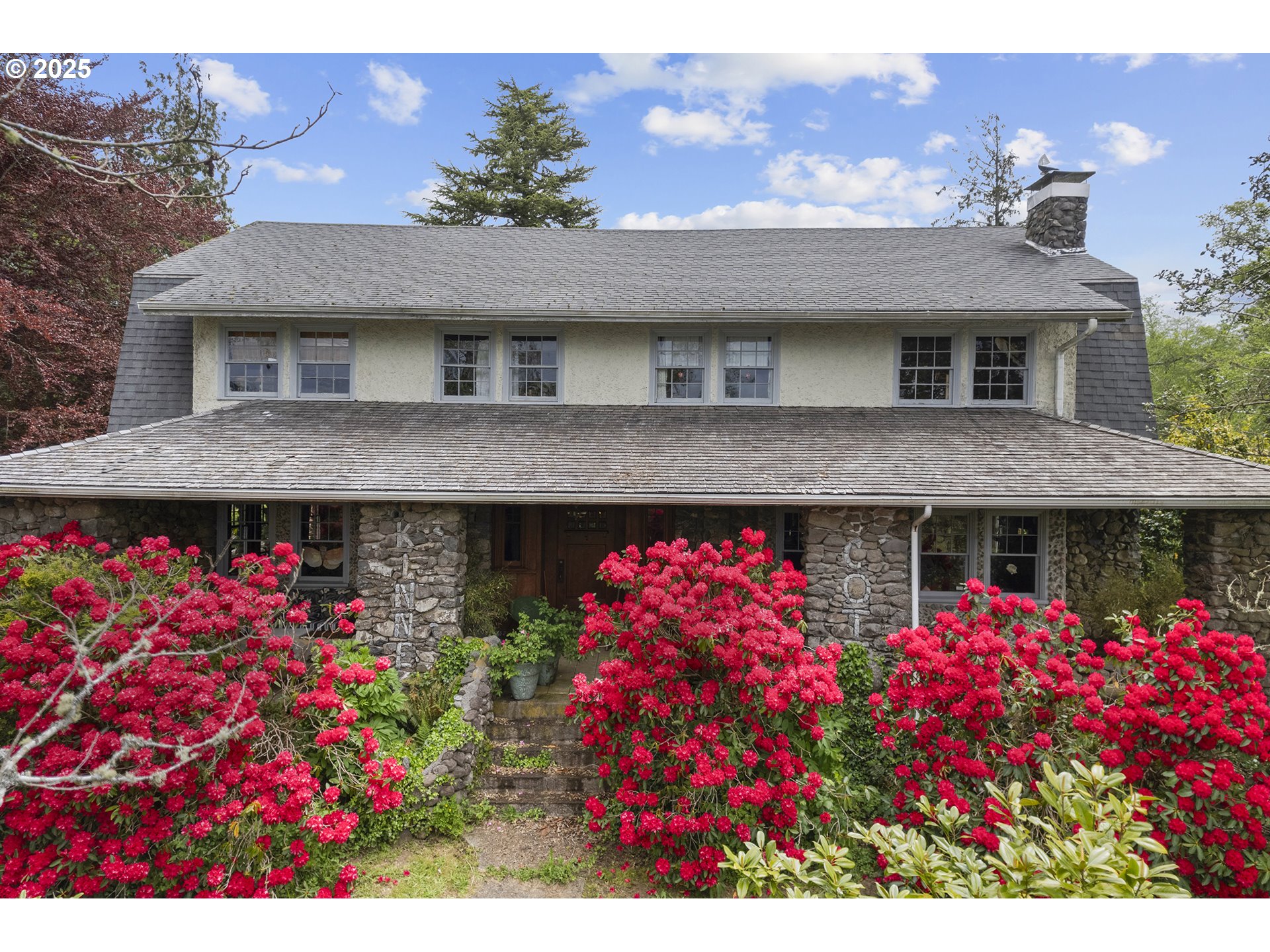 91755 Lewis And Clark Road Astoria, OR 97103 - Photo 41 of 48 a front view of house with lot of flowers