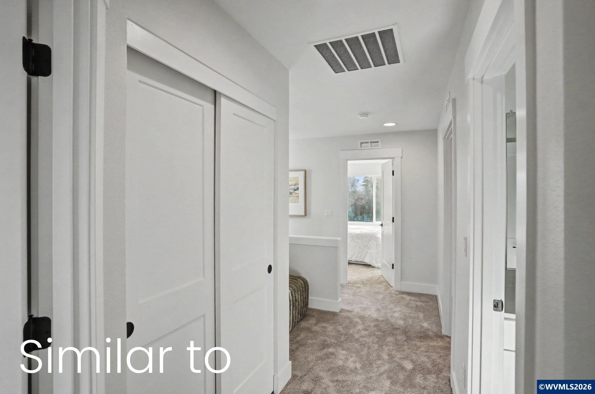 2550 Promise Way Lebanon, OR 97355 - Photo 24 of 35 a view of a hallway with wooden cabinet and door