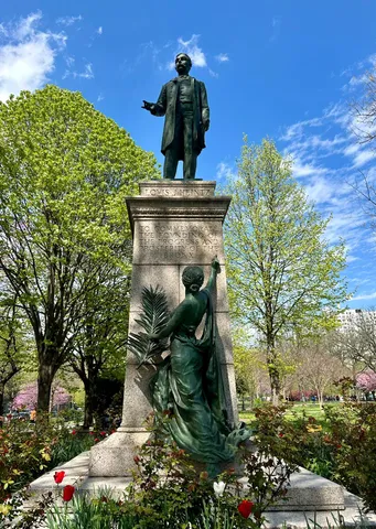 a view of a statue in a garden