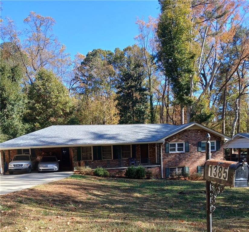 1385 Linkwood Lane Decatur, GA 30033 - Photo 1 of 16 a front view of a house with garden