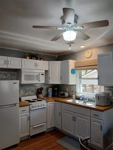 a kitchen with a refrigerator and cabinets