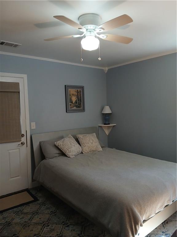 1385 Linkwood Lane Decatur, GA 30033 - Photo 6 of 16 a bedroom with a bed and a chandelier