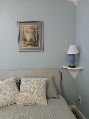 a living room with furniture and a lamp