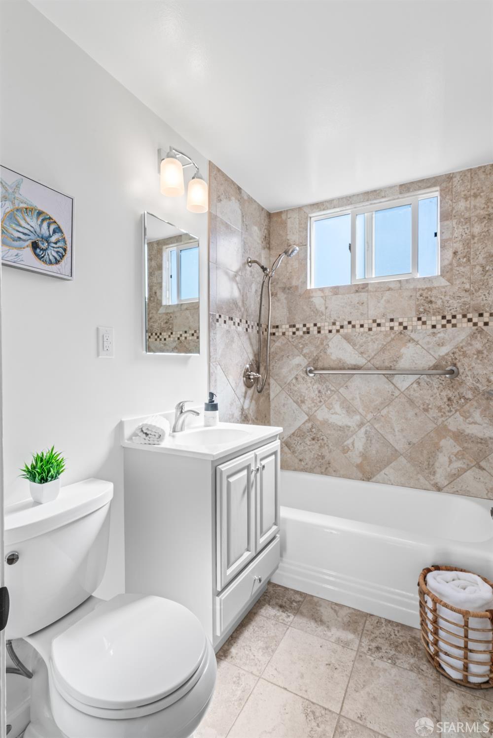 849 Hillside Boulevard Daly City, CA 94014 - Photo 12 of 17 a bathroom with a sink a toilet and bathtub