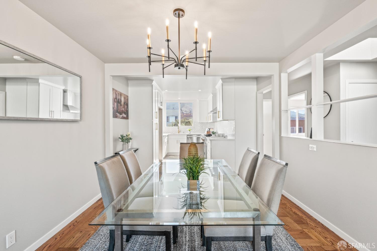 849 Hillside Boulevard Daly City, CA 94014 - Photo 5 of 17 a view of a dining room with furniture a chandelier and wooden floor