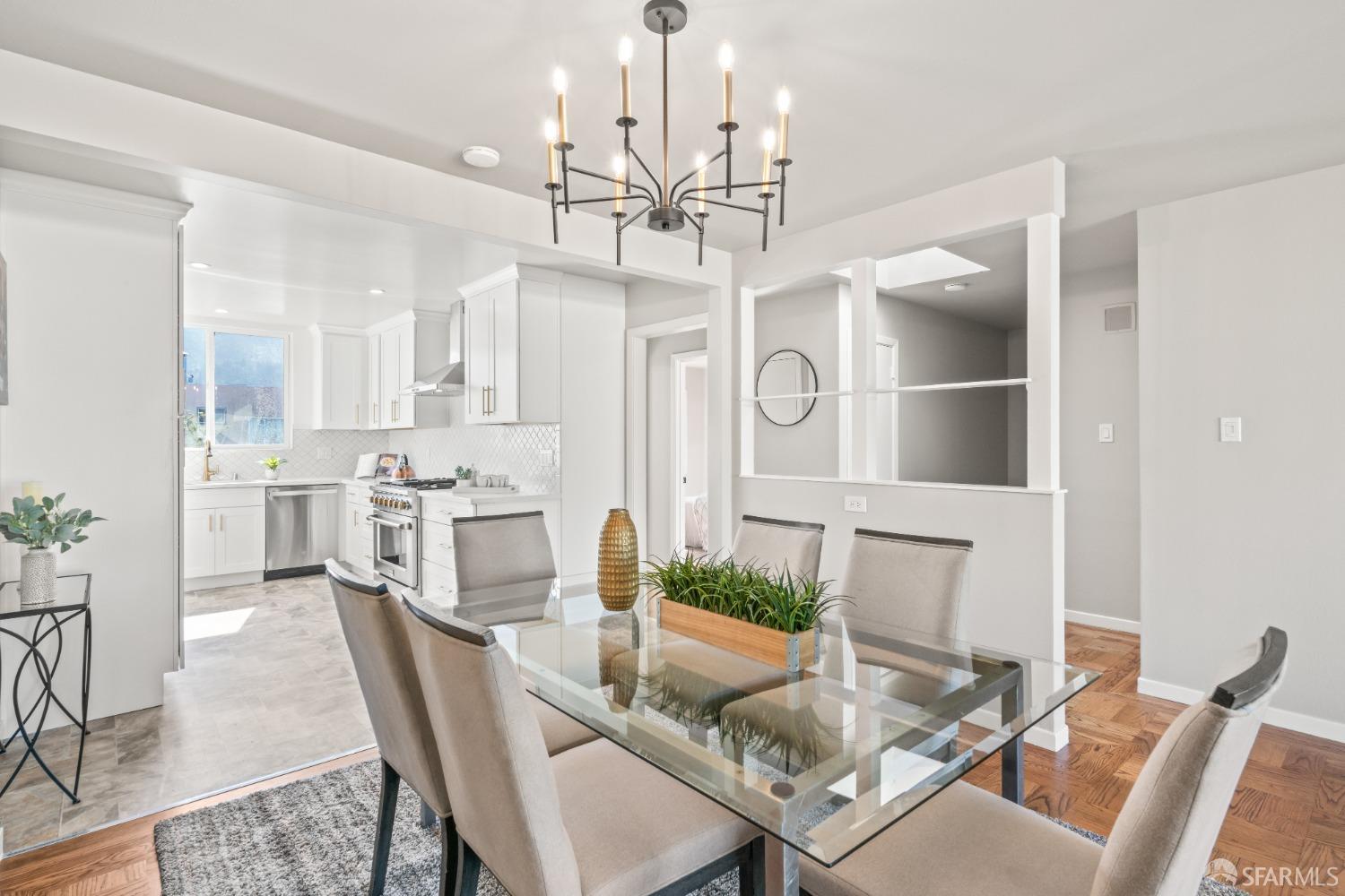849 Hillside Boulevard Daly City, CA 94014 - Photo 6 of 17 a view of a dining room with furniture and a chandelier