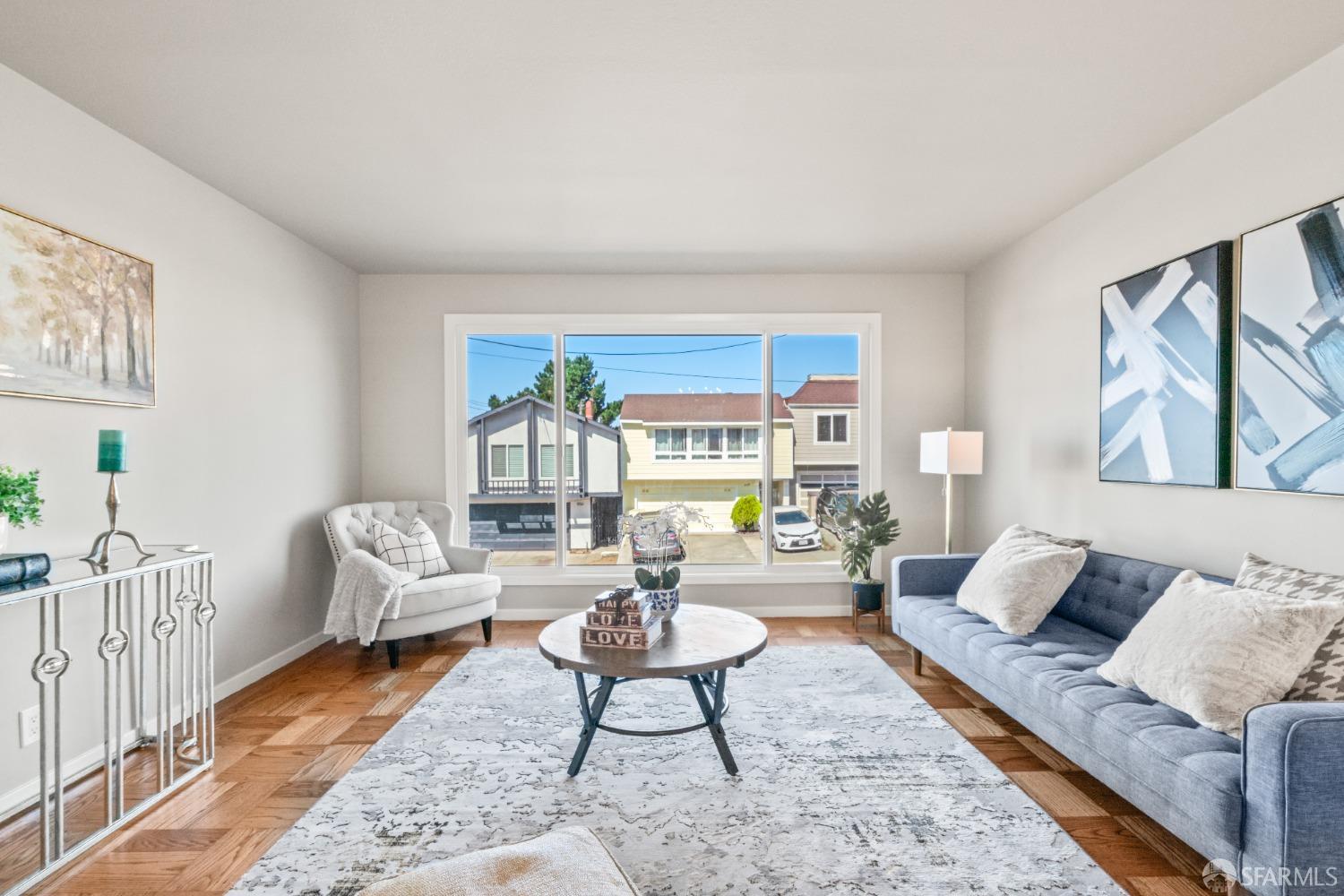 849 Hillside Boulevard Daly City, CA 94014 - Photo 7 of 17 a living room with furniture and a large window