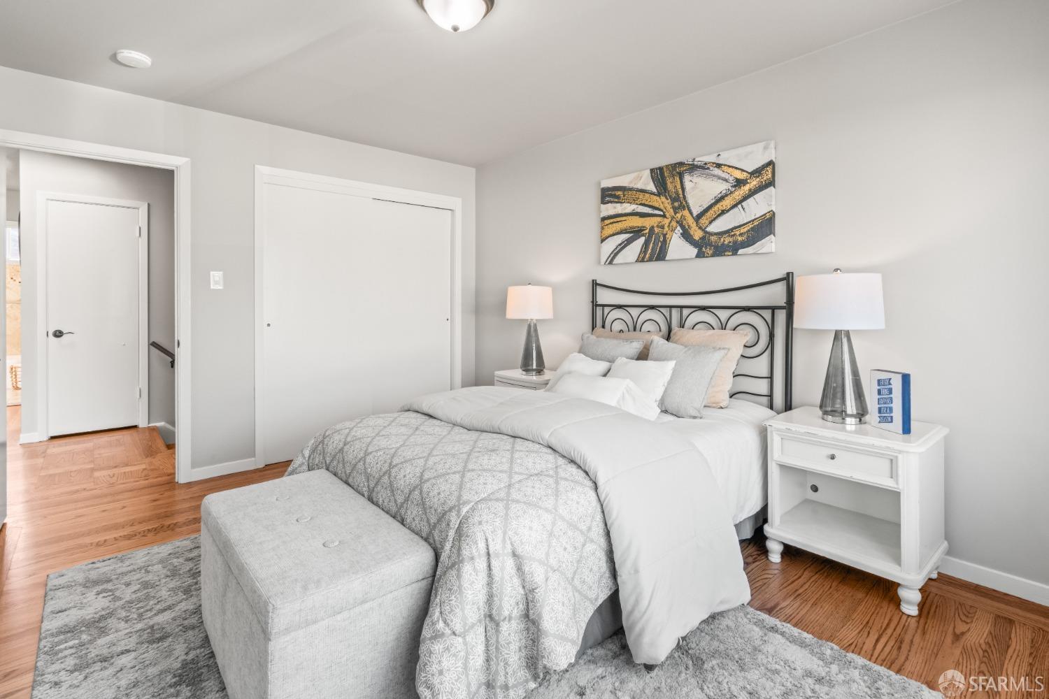 849 Hillside Boulevard Daly City, CA 94014 - Photo 10 of 17 a bedroom with a bed and a night stand