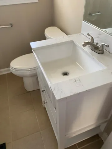 a bathroom with a sink and a toilet