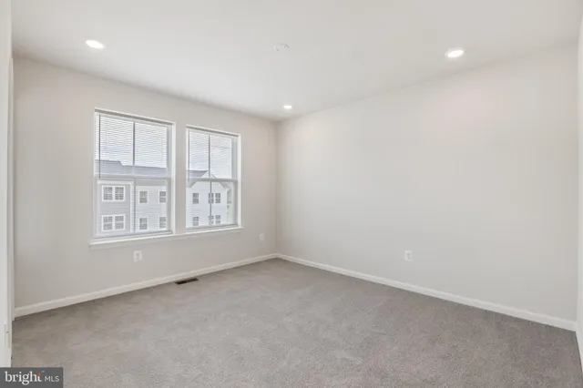 an empty room with a bathroom