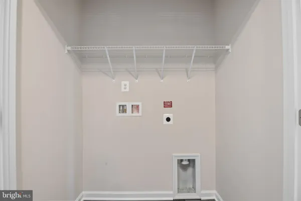 a kitchen with granite countertop a stove a sink and a microwave