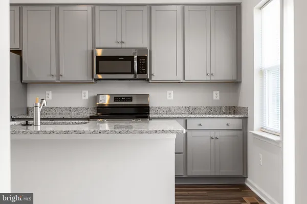 a view of a sink and a window