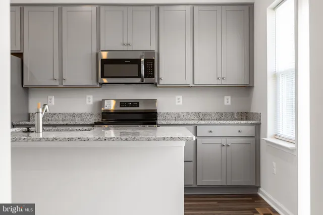 a view of a sink and a window