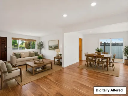 a living room with furniture a dining table and a wooden floor