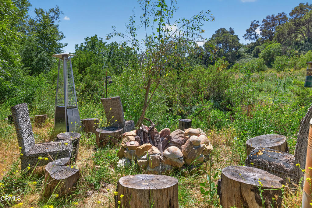 8416 Wheeler Canyon Road Santa Paula, CA 93060 - Photo 36 of 48 a backyard of a house with fire pit and outdoor seating