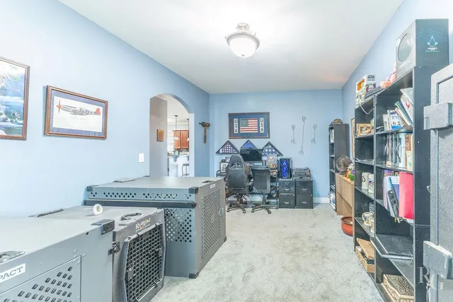 a view of a workspace with furniture