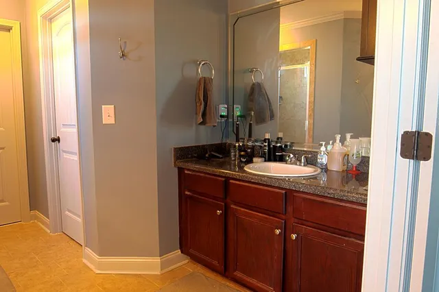 a bathroom with a sink and a mirror