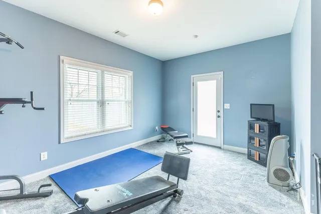 a workspace with furniture and a window