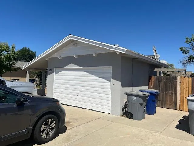 a view of a car park in front of house