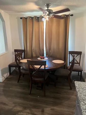a view of a livingroom with furniture and a table