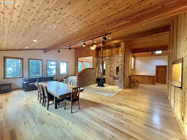 a bedroom with furniture and wooden floor