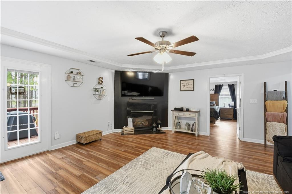 212 Lennox Loop Raeford, NC 28376 - Photo 10 of 47 a bedroom with furniture and a fireplace