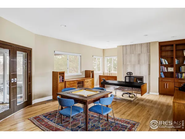 a living room with furniture a rug and a window