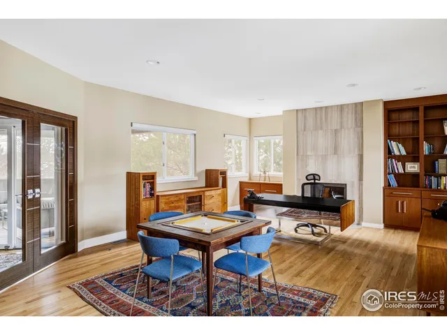 a living room with furniture a rug and a window