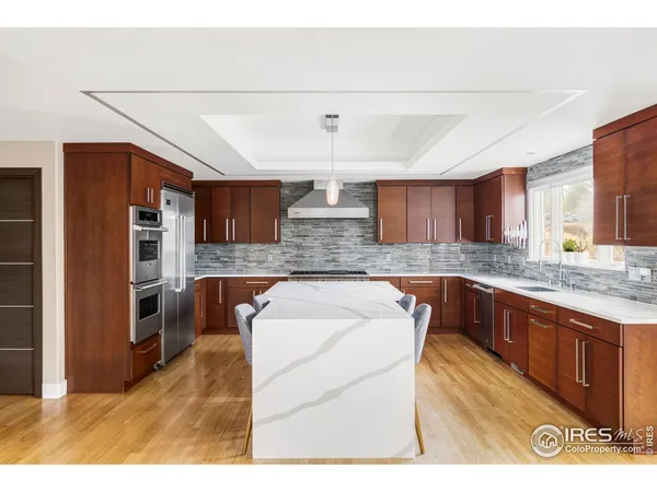 a kitchen with stainless steel appliances granite countertop a sink and cabinets