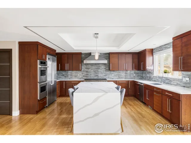 a kitchen with stainless steel appliances granite countertop a sink and cabinets
