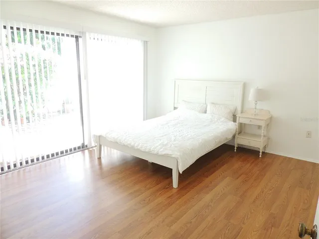 a bathroom with a granite countertop toilet and a shower