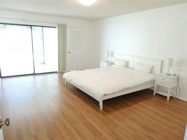 a bathroom with a shower sink and mirror