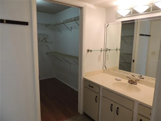 a white toilet sitting next to a shower