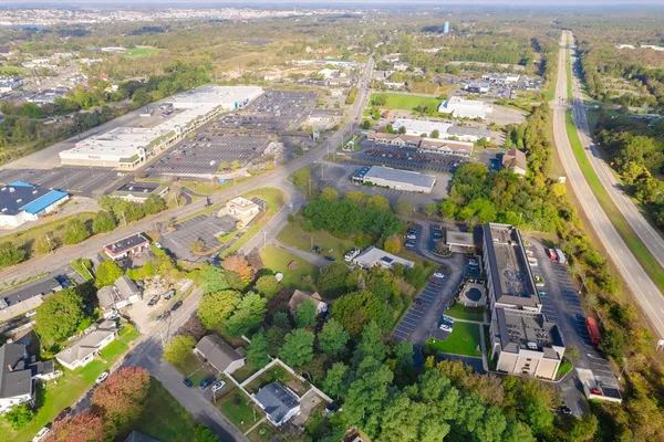 a view of pool with trees in the background