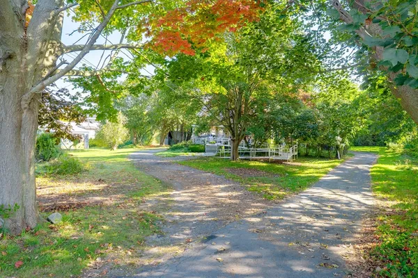 an aerial view of a house with yard swimming pool and outdoor seating
